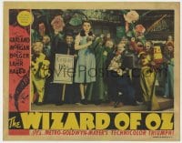 2m394 WIZARD OF OZ LC 1939 Judy Garland with Munchkins & coroner, The Wicked Witch must die, rare!