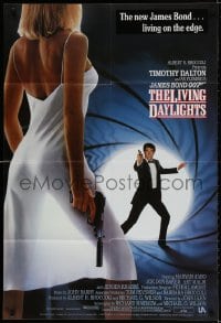 2p531 LIVING DAYLIGHTS int'l 1sh 1987 Tim Dalton as James Bond & sexy Maryam d'Abo w/gun!
