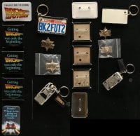 2y435 LOT OF 9 BACK TO THE FUTURE PIN-BACK BUTTONS, PINS, AND KEYCHAINS 1985 variety of cool items!