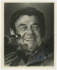 3d439 ARTHUR GODFREY signed 8.25x10 still 1970s smiling close up talking into microphone!