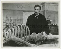 3d467 CHRISTOPHER LEE signed 8x10 still 1972 close up examining skeleton in The Creeping Flesh!