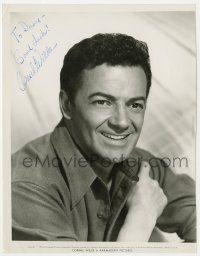 3d472 CORNEL WILDE signed 7.75x10 still 1957 great smiling portrait when making The Devil's Hairpin!