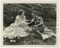 3h620 MASKS OF THE DEVIL 8x10 still 1928 Mona Barrie & John Gilbert outdoors sitting on grass!