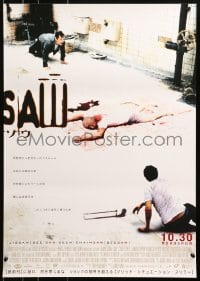 3p661 SAW advance Japanese 2004 James Wan gory serial killer, image of guys trapped with dead body!