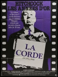 3w892 ROPE French 1p R1984 great image of director Alfred Hitchcock holding clapboard!