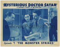 4a676 MYSTERIOUS DOCTOR SATAN chapter 7 LC 1940 Robert Wilcox with newspaper, The Monster Strikes!