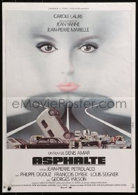 4y137 ASPHALTE French 16x22 1981 image of cars piled up on highway & Landi art of face in sky!