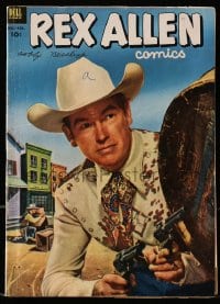 5d095 REX ALLEN #7 comic book 1953 great cover portrait of the cowboy star with two guns drawn!