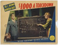 5m340 $1,000 A TOUCHDOWN LC 1939 Joe E. Brown smiles as Martha Raye looks at his football play!