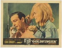 5m537 GOLDFINGER LC #2 1964 c/u of sexy Shirley Eaton behind Sean Connery as James Bond on phone!
