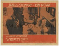 5w919 VERTIGO LC #5 1958 Alfred Hitchcock, standing James Stewart on phone,blonde Kim Novak in bed!
