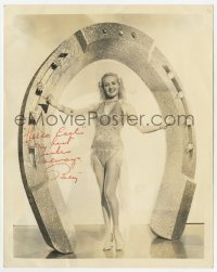 6b247 BETTY GRABLE signed deluxe 8x10 fan club still 1950s in skimpy outfit by big diamond horseshoe!