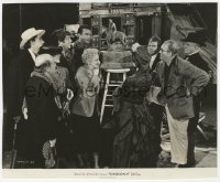 6w348 STAGECOACH candid 7.5x9.25 still 1939 John Wayne, Ford & cast w/ Will Rogers memorial figure!