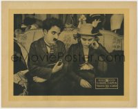 6w393 BEHIND THE SCREEN LC R1920s c/u of concerned Charlie Chaplin with pipe by sad Edna Purviance!