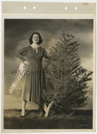 7f349 FAITH DOMERGUE 8x11 key book still 1950 cutting down a Christmas tree w/ saw by Alex Kahle!