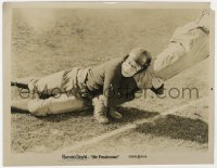 7f381 FRESHMAN 8x10.25 still 1925 great c/u of football player Harold Lloyd grabbing opponent's leg!