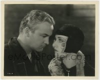 7f471 HIGH VOLTAGE 8x10 still 1929 c/u of angry William Boyd glaring at Carole Lombard in cool hat!