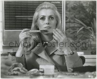 7f578 LA CHAMADE 8.25x10 still 1969 Catherine Deneuve close up holding butter knife at table!