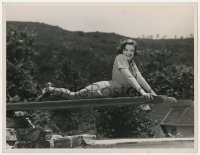 7h248 JUDY GARLAND deluxe 10x13 still 1940 laying down on the diving board at her Hollywood home!