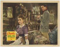 7p153 CLAUDIA LC 1943 Robert Young watches worried Dorothy McGuire, who is shining his shoes!