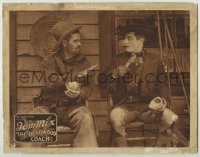 7p205 DEADWOOD COACH LC 1924 great c/u of tough cowboy warning Tom Mix about eating with knife!