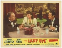 7p471 LADY EVE LC R1949 Preston Sturges, classic scene of Stanwyck & Coburn fleecing Henry Fonda!