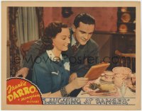 7p484 LAUGHING AT DANGER LC 1940 Frankie Darro & Joy Hodges look at picture after eating dinner!