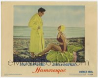 8a075 HUMORESQUE LC #5 1946 Joan Crawford in swimsuit smiles at John Garfield in robe on the beach!