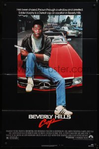 8f097 BEVERLY HILLS COP 1sh 1984 great image of detective Eddie Murphy sitting on red Mercedes!