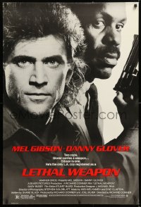 9c701 LETHAL WEAPON 1sh 1987 great close image of cop partners Mel Gibson & Danny Glover!