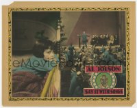 3r1353 SAY IT WITH SONGS LC 1929 split image of Al Jolson performing on stage & Davey Lee in bed!