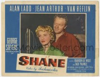 3r1363 SHANE LC #7 1953 close portrait of smiling Van Heflin standing behind pretty Jean Arthur!