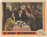 3z0985 MAN BETRAYED LC 1941 Devil watches John Wayne & Frances Dee with waiter in restaraunt!