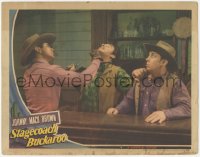 3z1226 STAGECOACH BUCKAROO LC 1942 close up of Johnny Mack Brown punching bad guy in the jaw!