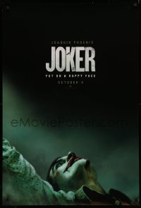 4a0922 JOKER teaser DS 1sh 2019 close-up image of clown Joaquin Phoenix, put on a happy face!