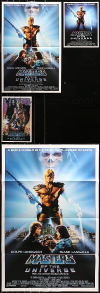 4x0470 LOT OF 37 FOLDED MASTERS OF THE UNIVERSE ONE-SHEETS, MINI POSTERS, AND PROMO BROCHURES 1986