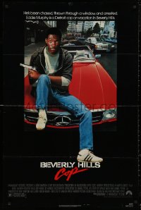 5d0100 BEVERLY HILLS COP 1sh 1984 great image of detective Eddie Murphy sitting on red Mercedes!