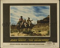 JW 271 SEARCHERS lobby card #8 '56 John Wayne on horse w/rifle!