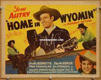 v132 HOME IN WYOMIN' title movie lobby card '42 Autry on radio w/guitar!
