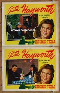 h355 TROUBLE IN TEXAS 2 movie lobby cards R40s Tex Ritter, Rita Hayworth