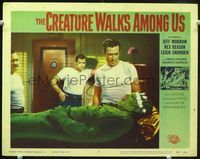 1w107 CREATURE WALKS AMONG US movie lobby card #8 '56 men operate on bandaged monster laying down!