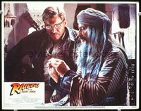 1w285 RAIDERS OF THE LOST ARK LC #7 '81 Harrison Ford in glasses with Arab guy examining clue!