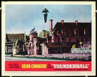 1w367 THUNDERBALL lobby card #8 '65 Sean Connery as James Bond using jetpack to fly over city!