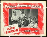 2v146 KEY LARGO LC #4 '48 Humphrey Bogart offers a smoke to Claire Trevor, Lauren Bacall looks on!