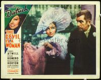 3b352 DEVIL IS A WOMAN LC '35 great c/u of Marlene Dietrich in wild hat with Edward Everett Horton!