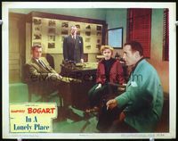 3b441 IN A LONELY PLACE LC '50 Humphrey Bogart with cigarette is stared at by sexy Gloria Grahame!
