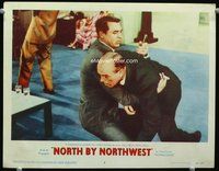 3b521 NORTH BY NORTHWEST lobby card #4 '59 Cary Grant holds knife in stabbed man, Alfred Hitchcock