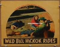 4b969 WILD BILL HICKOK RIDES lobby card '42 Constance Bennett helps Bruce Cabot after shootout!