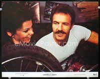 4c110 CINDERELLA LIBERTY color 11x14 #8 '74 c/u of laughing Marsha Mason & James Caan fixing bike!