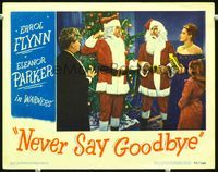 4c530 NEVER SAY GOODBYE lobby card '46 great image of Errol Flynn in Santa suit getting into fight!